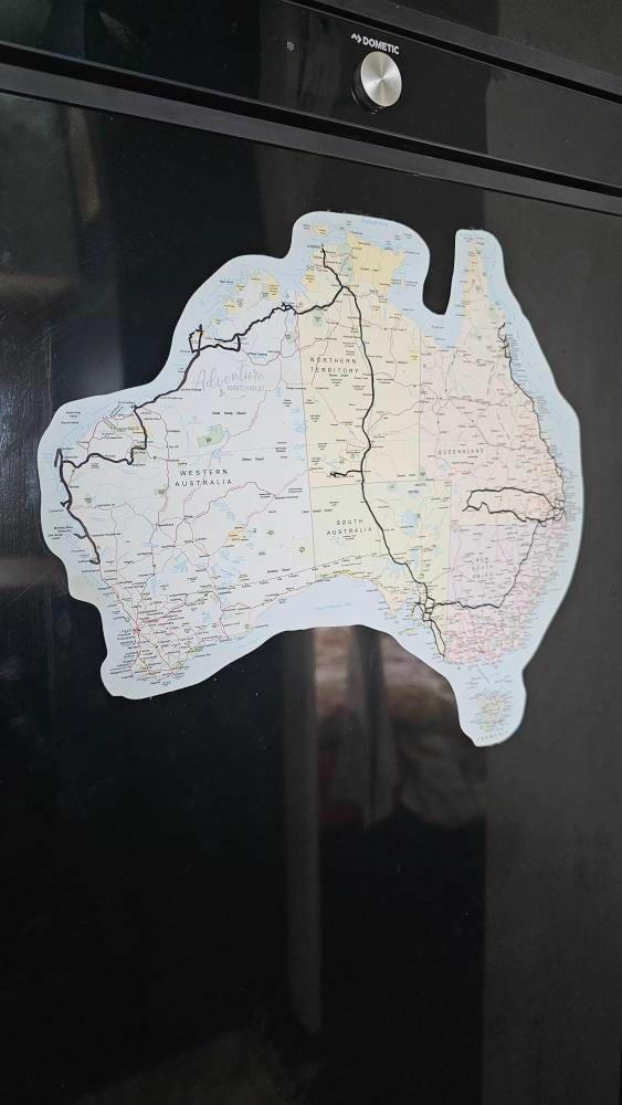 Family marking their travels on the Map of Australia caravan sticker