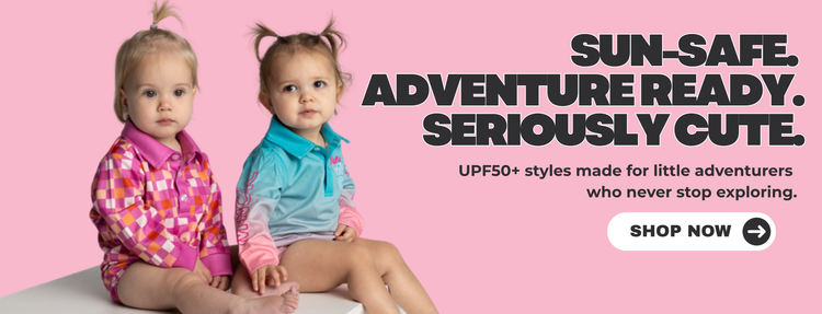 Two toddlers in UPF50+ sun-safe shirts sitting together - sun-safe, adventure ready, seriously cute